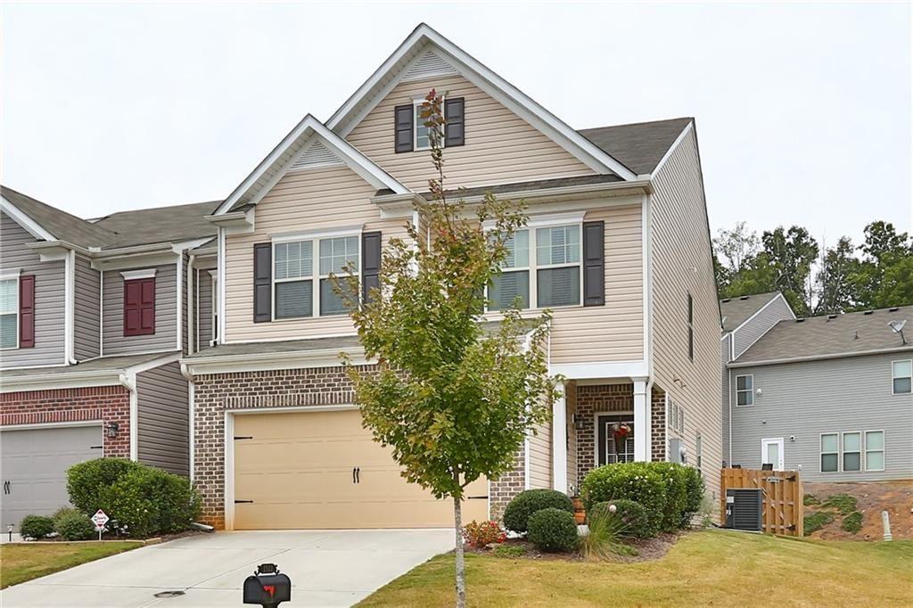 1311 Brookmere Way Cumming, GA 30040 - Photo 1 of 24 a view of a yard in front of house