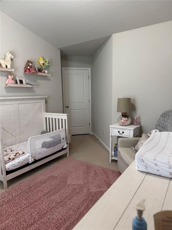 1311 Brookmere Way Cumming, GA 30040 - Photo 12 of 24 a bedroom with a bed and a window