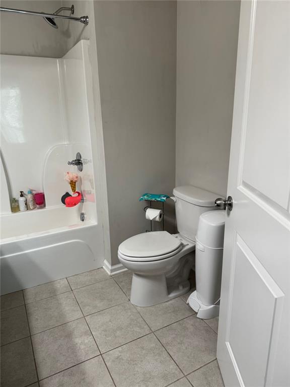 1311 Brookmere Way Cumming, GA 30040 - Photo 13 of 24 a bathroom with a toilet and a shower