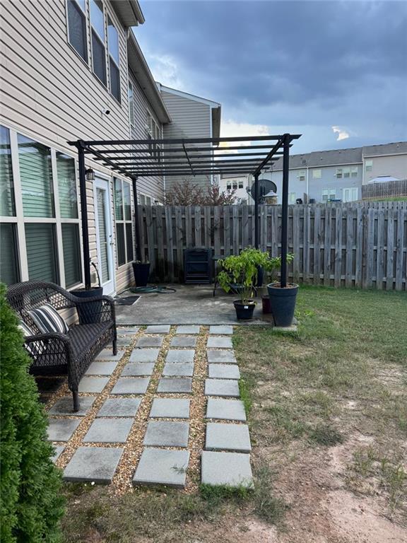 1311 Brookmere Way Cumming, GA 30040 - Photo 24 of 24 a view of a backyard with sitting area