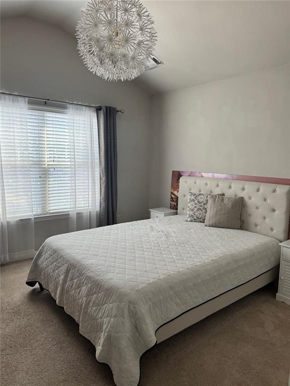 1311 Brookmere Way Cumming, GA 30040 - Photo 9 of 24 a bedroom with a bed and window