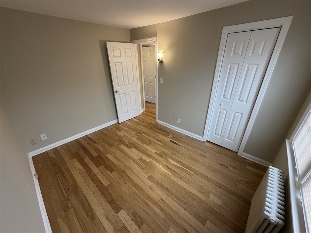 474 Cold Spring Avenue, Unit 474 West Springfield, MA 01089 - Photo 16 of 22 a view of empty room with wooden floor