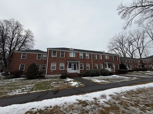 a front view of residential houses with yard