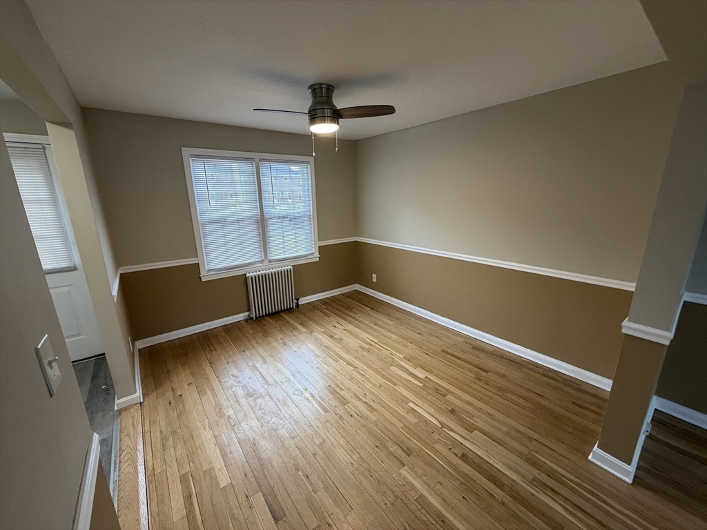 474 Cold Spring Avenue, Unit 474 West Springfield, MA 01089 - Photo 7 of 22 wooden floor in an empty room with a window