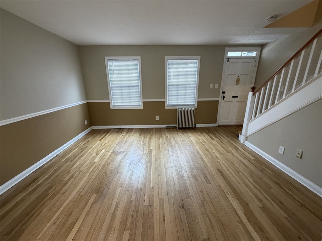 474 Cold Spring Avenue, Unit 474 West Springfield, MA 01089 - Photo 8 of 22 wooden floor in an empty room with a window