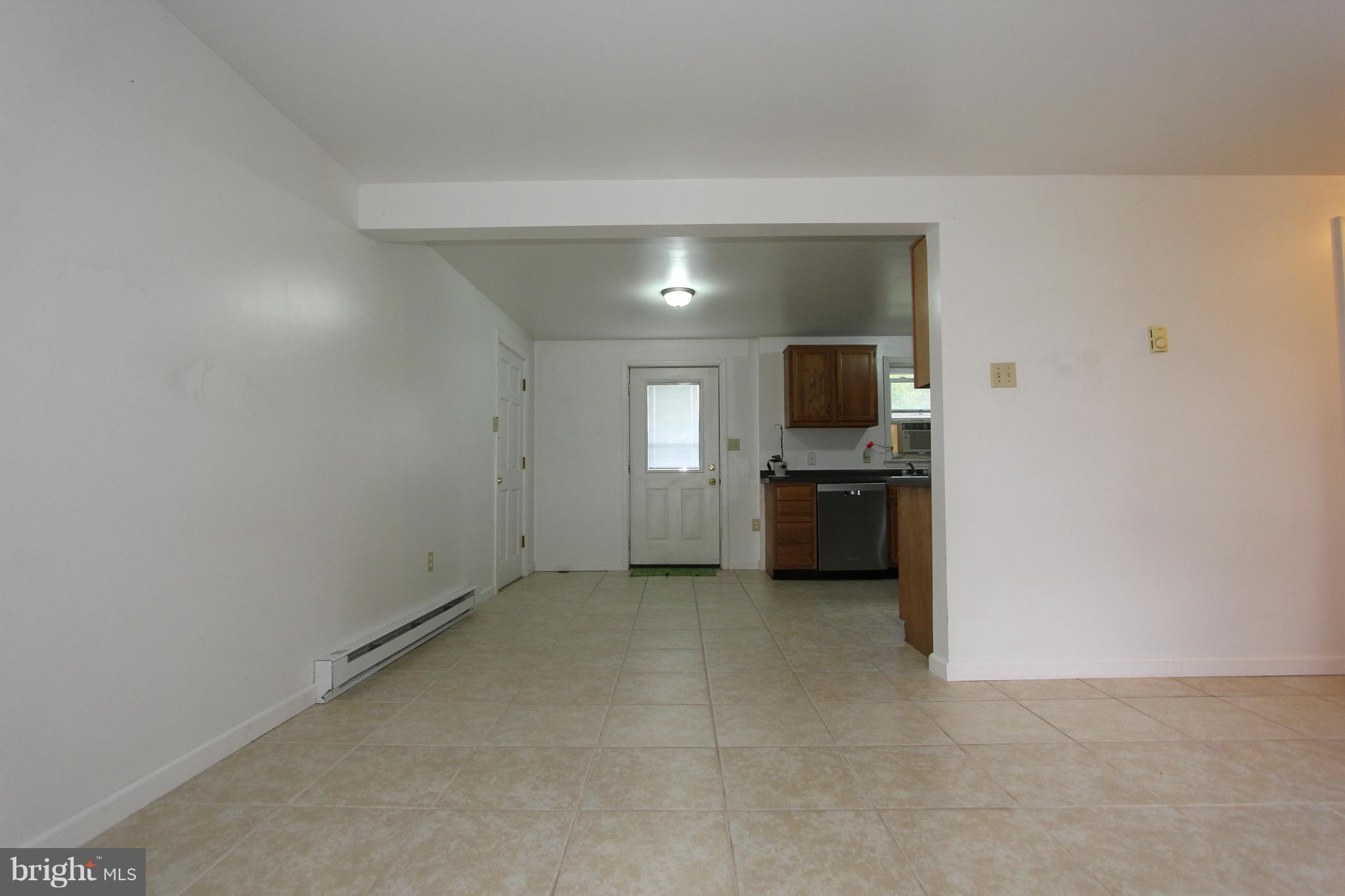 9841 Bartgis Road Frederick, MD 21702 - Photo 16 of 24 Family / living room open to kitchen downstairs