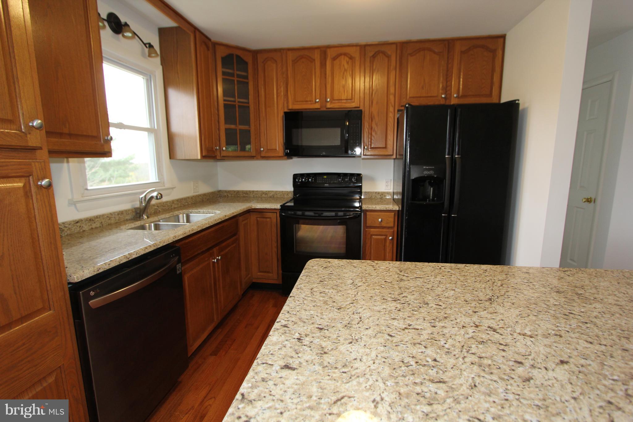 9841 Bartgis Road Frederick, MD 21702 - Photo 5 of 24 Granite counters and new appliances
