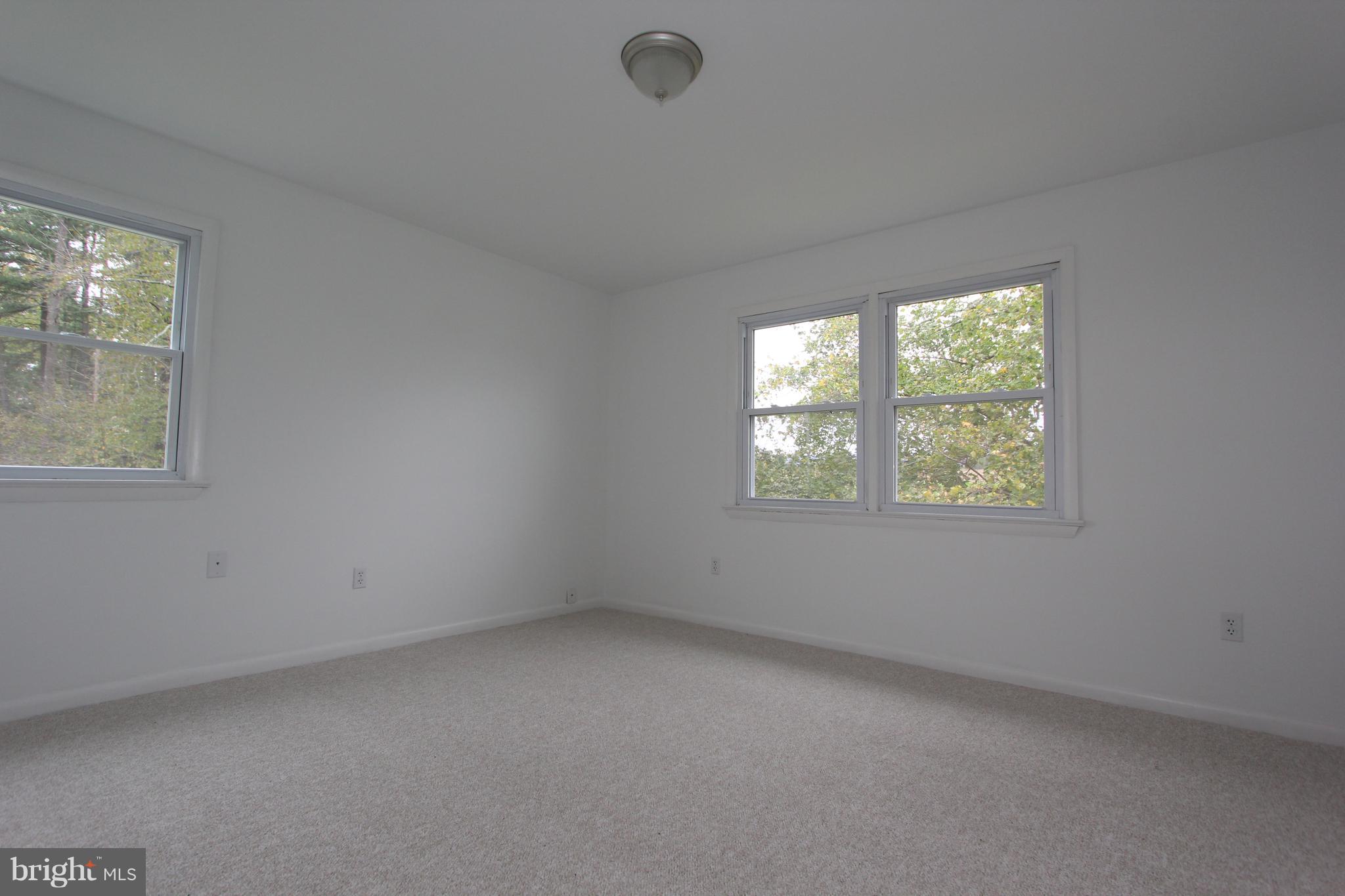 9841 Bartgis Road Frederick, MD 21702 - Photo 9 of 24 Upstairs bedroom 1 with new carpet and fixture