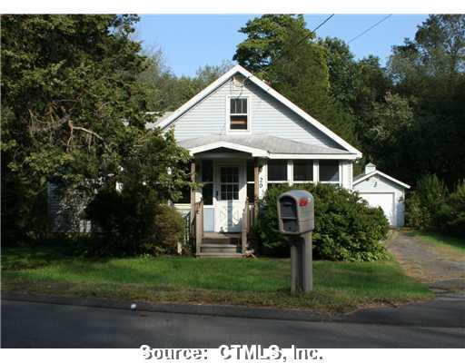 20 Highland Road Woodbridge, CT 06525 - Photo 1 of 1 a front view of a house with a yard