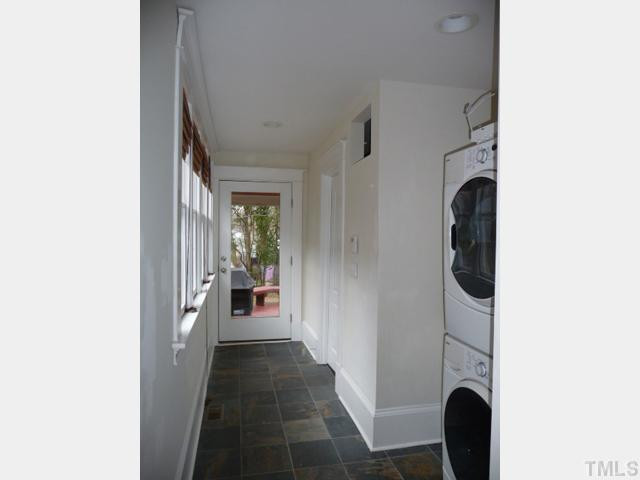 625 East Franklin Street Raleigh, NC 27604 - Photo 9 of 25 A slate-tiled, windowed hall leads to the back porch and deck from the kitchen. Offering a 2nd access to the back bath, It doubles as a mud room and laundry coveniently located by the back door.