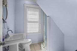 81 5th Avenue, Unit 1 Lowell, MA 01854 - Photo 8 of 16 a bathroom with a toilet sink and a window