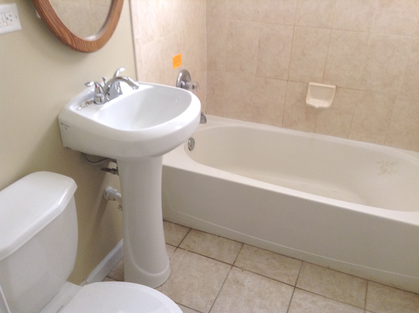 32 Monee Road Park Forest, IL 60466 - Photo 4 of 4 a bathroom with a sink a toilet and a bathtub