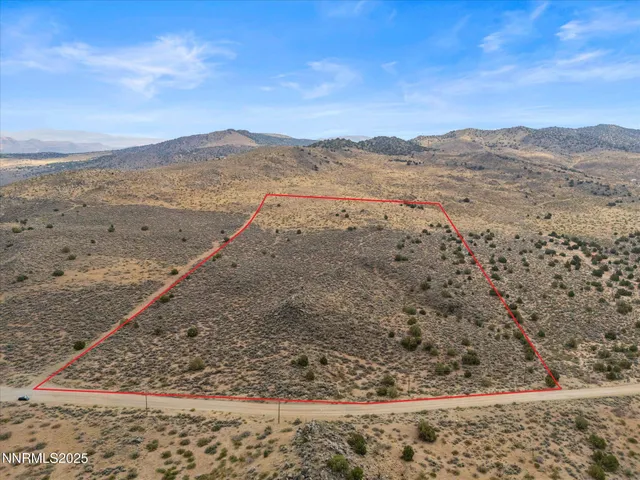 a view of ocean beach and mountain