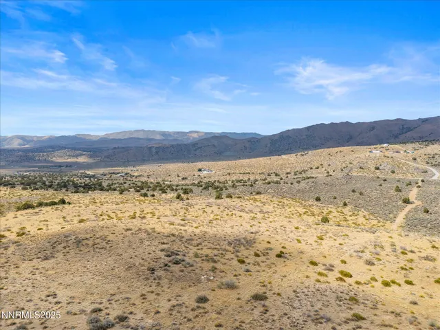 a view of an ocean beach and mountain