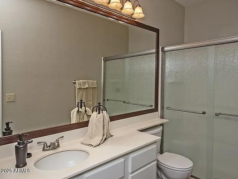 11375 East Sahuaro Drive, Unit 2041 Scottsdale, AZ 85259 - Photo 11 of 17 a bathroom with a sink toilet and shower