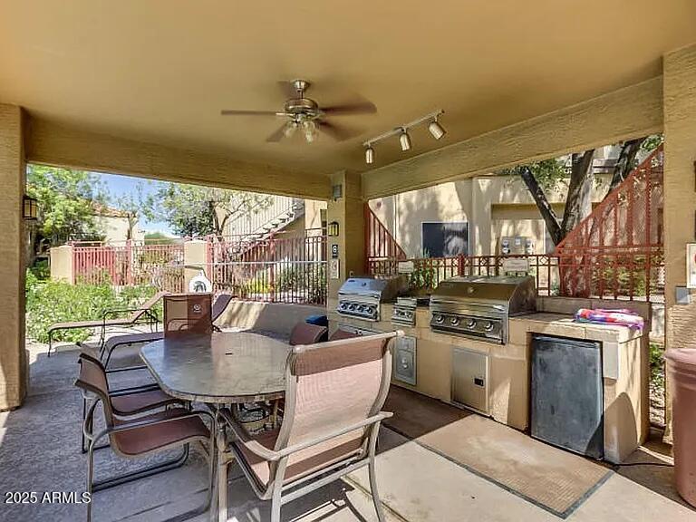 11375 East Sahuaro Drive, Unit 2041 Scottsdale, AZ 85259 - Photo 12 of 17 a dining room with furniture a chandelier and wooden floor