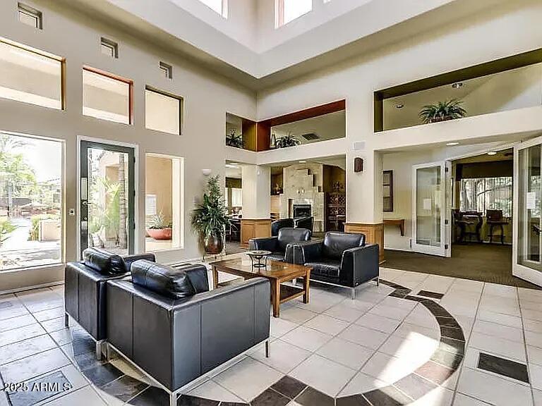 11375 East Sahuaro Drive, Unit 2041 Scottsdale, AZ 85259 - Photo 13 of 17 a living room with furniture large window and a table