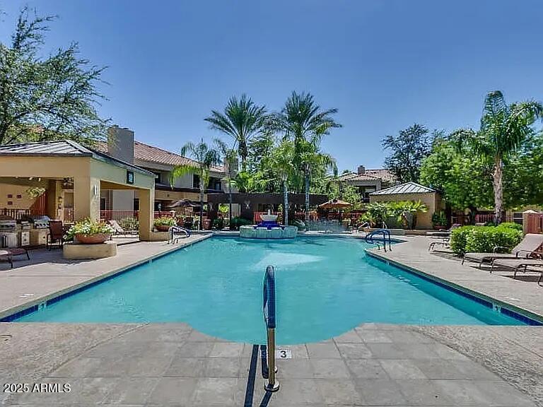 11375 East Sahuaro Drive, Unit 2041 Scottsdale, AZ 85259 - Photo 15 of 17 a front view of a house with garden and sitting area