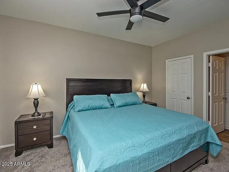 11375 East Sahuaro Drive, Unit 2041 Scottsdale, AZ 85259 - Photo 8 of 17 a bedroom with a bed and a lamp
