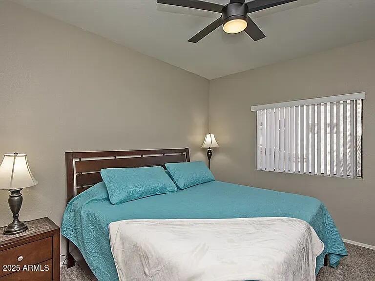 11375 East Sahuaro Drive, Unit 2041 Scottsdale, AZ 85259 - Photo 9 of 17 a bedroom with a bed and window