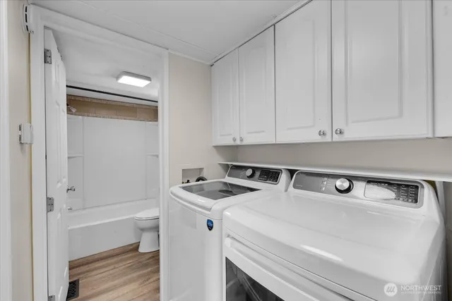 a utility room with washer and dryer
