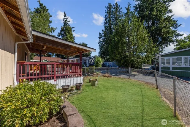 a view of a house with swimming pool and sitting area