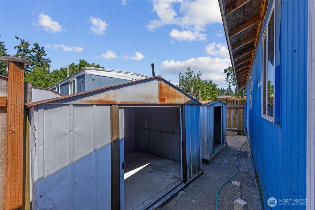 7614 Northeast Bothell Way, Unit 11 Kenmore, WA 98028 - Photo 21 of 26 a view of a house with a sink and glass windows