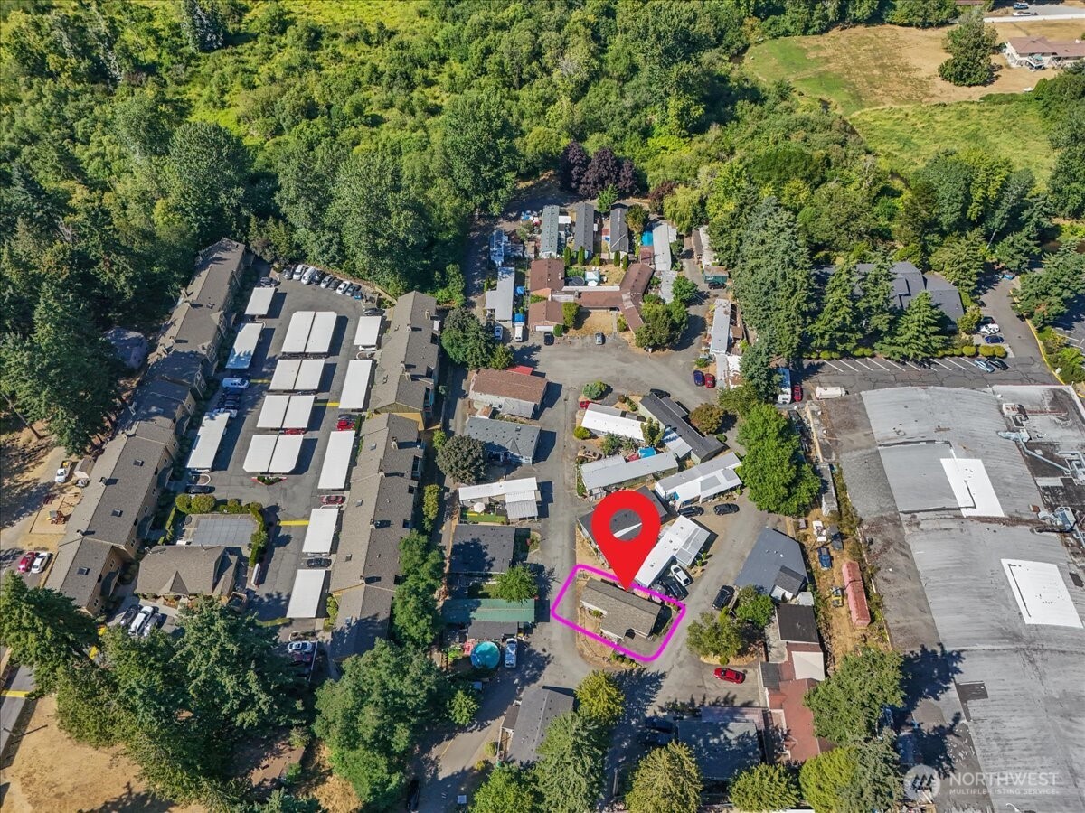 7614 Northeast Bothell Way, Unit 11 Kenmore, WA 98028 - Photo 23 of 26 an aerial view of residential house with outdoor space and trees all around
