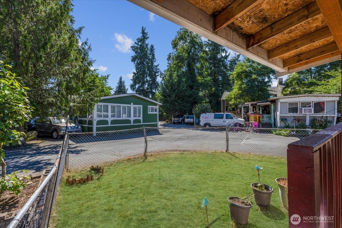 7614 Northeast Bothell Way, Unit 11 Kenmore, WA 98028 - Photo 4 of 26 a house view with a sitting space and garden