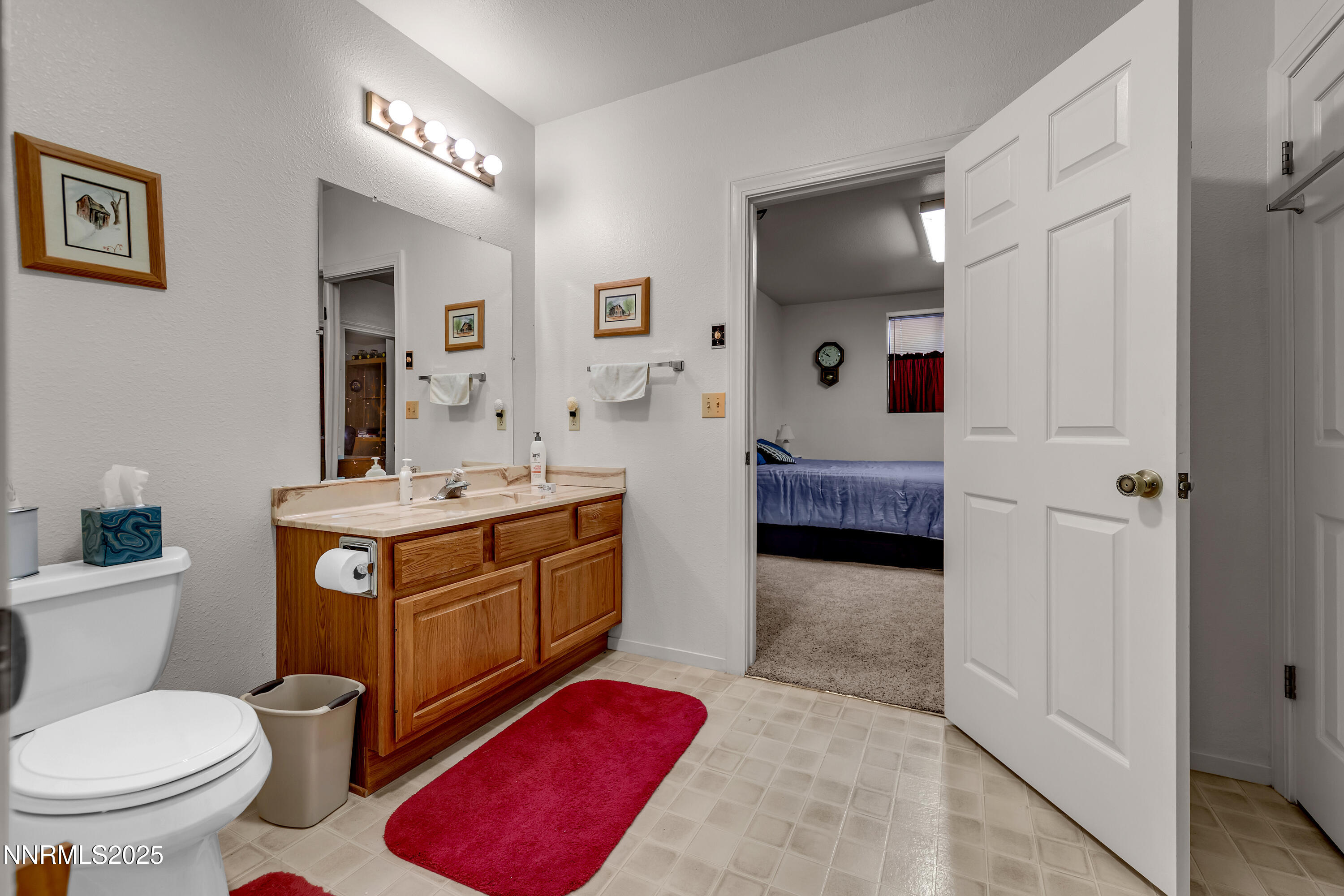 2855 Wilcox Ranch Road Reno, NV 89510 - Photo 13 of 36 a bathroom with a toilet sink and mirror