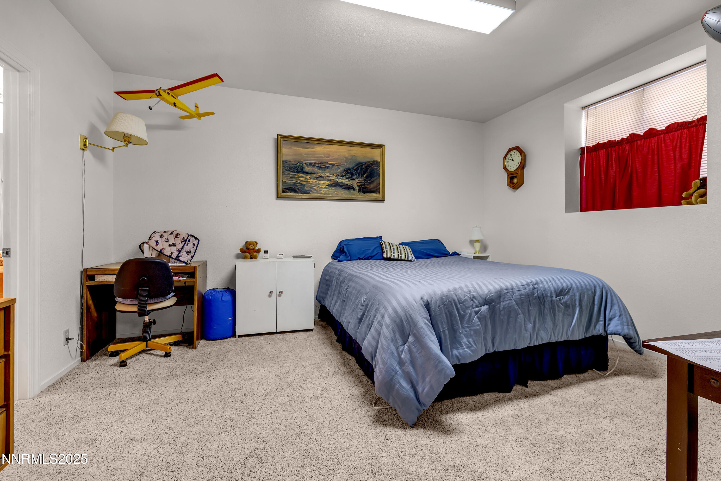 2855 Wilcox Ranch Road Reno, NV 89510 - Photo 17 of 36 a bedroom with a bed and dresser