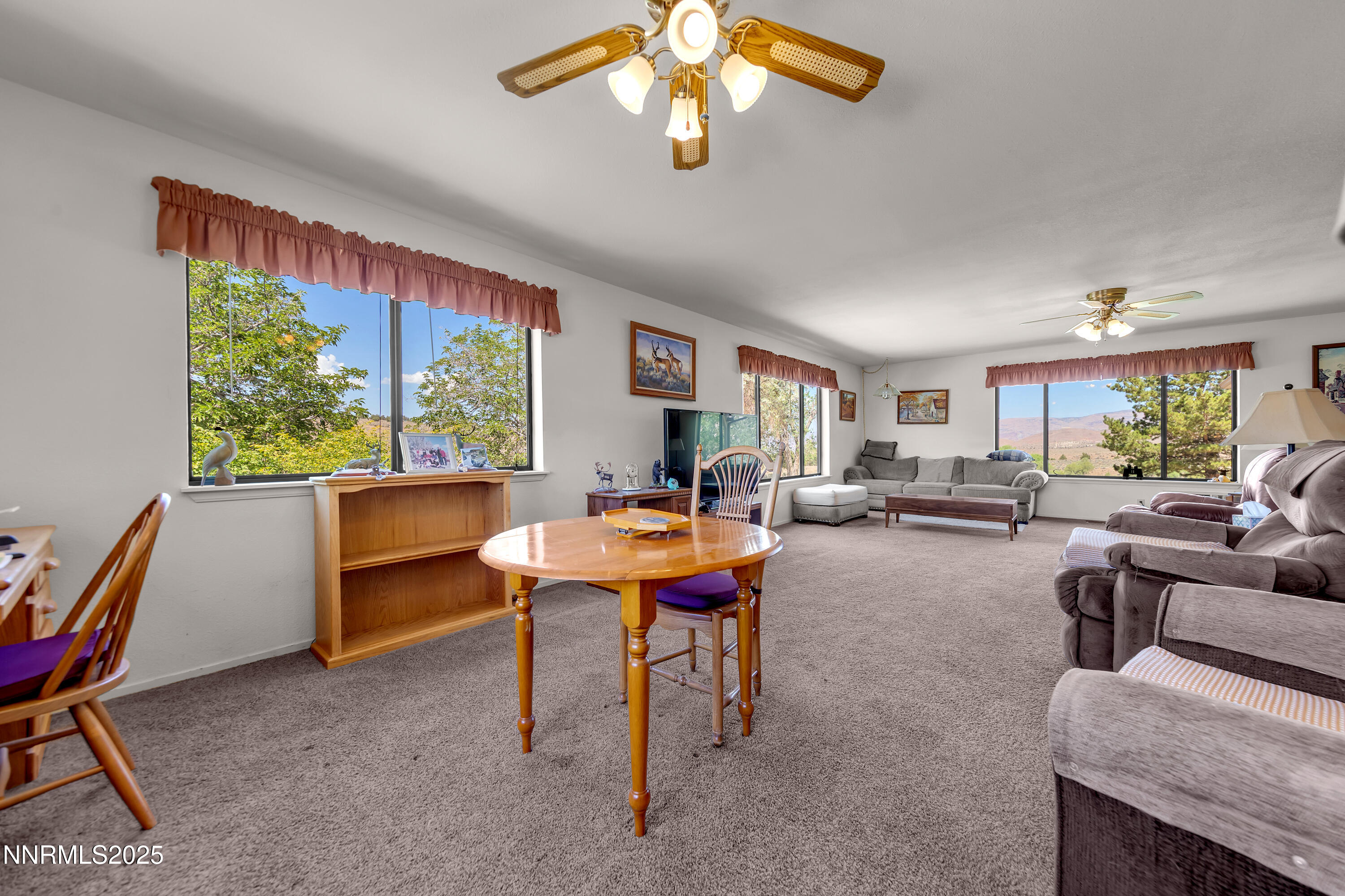 2855 Wilcox Ranch Road Reno, NV 89510 - Photo 6 of 36 a living room with furniture a window and a table