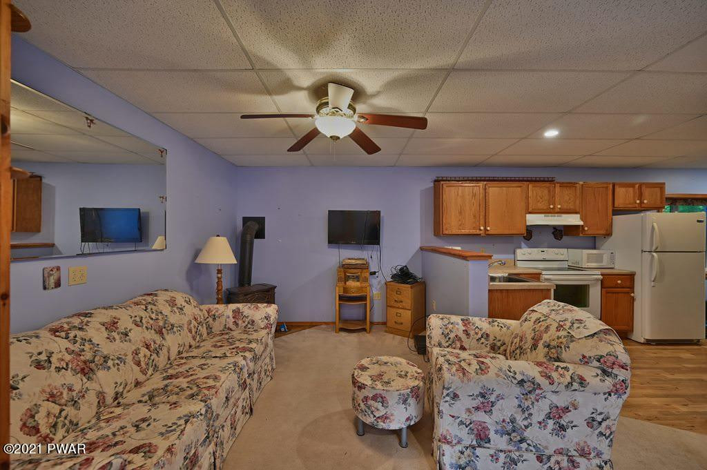 417 Northgate Road Lake Ariel, PA 18436 - Photo 53 of 91 a bedroom with furniture and a flat screen tv