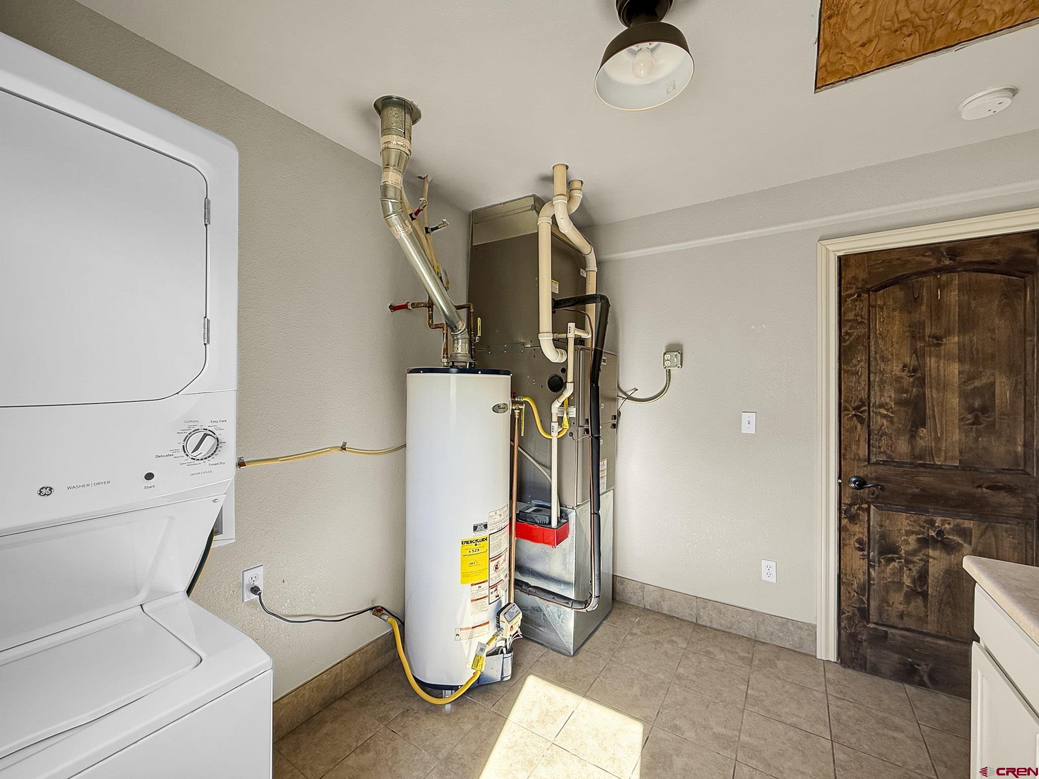 32310 B50 Road Crawford, CO 81415 - Photo 30 of 45 a utility room with dryer and washer