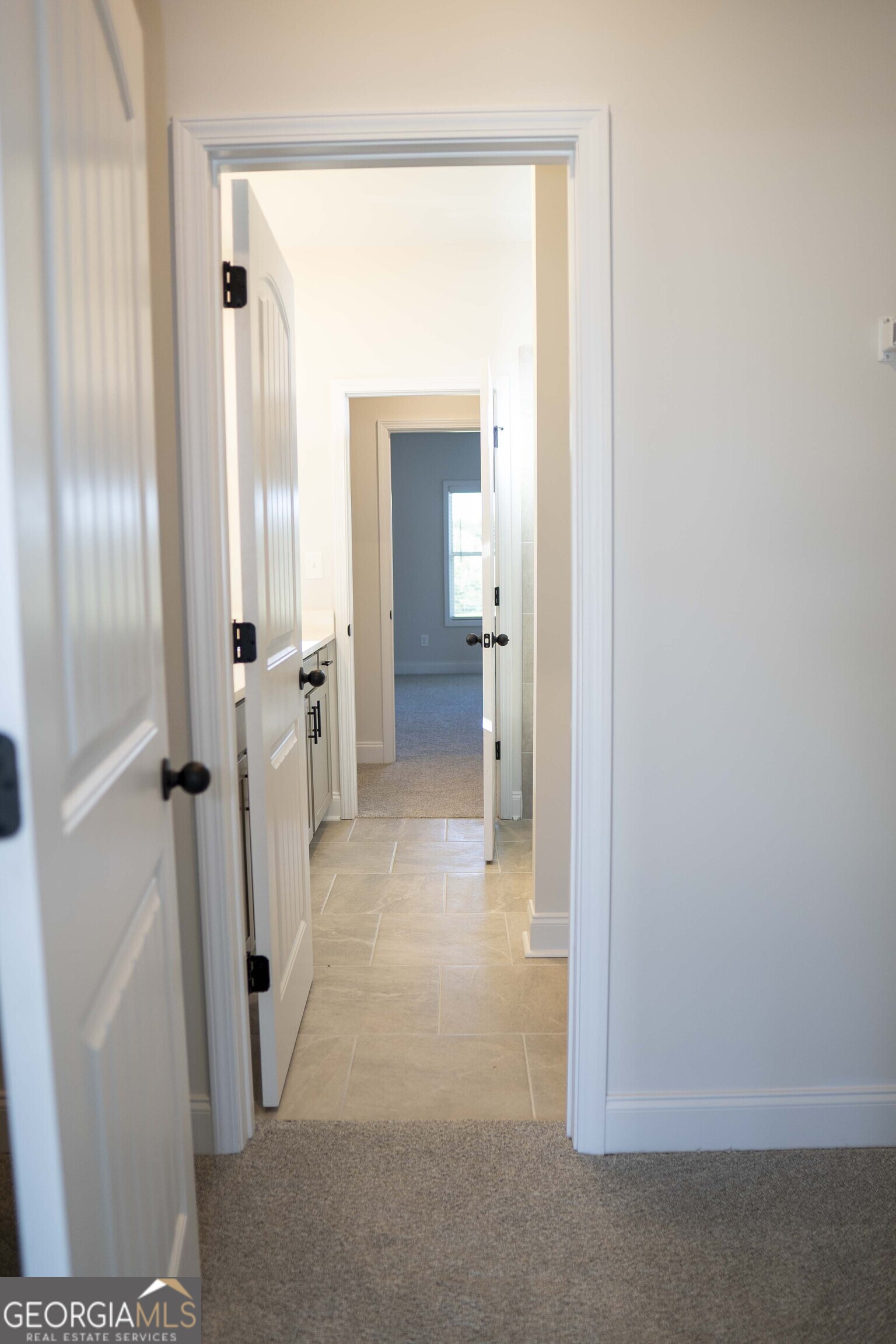 600 Beaver Court Perry, GA 31069 - Photo 39 of 48 a view of a bathroom from a hallway
