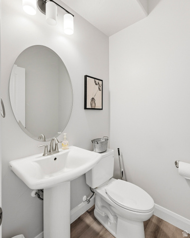 668 East Fiddlers Canyon Road, Unit 6 Cedar City, UT 84721 - Photo 12 of 36 Pedestal sink with a brushed nickel faucet and an oval mirror