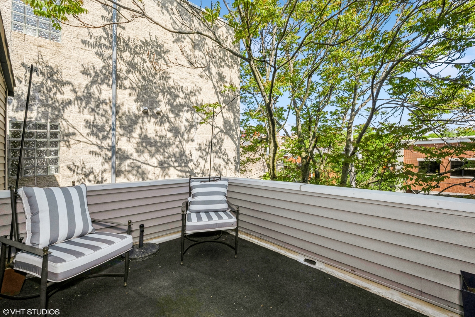 1306 West Fillmore Street, Unit 2 Chicago, IL 60607 - Photo 14 of 18 a view of a bench in a roof deck