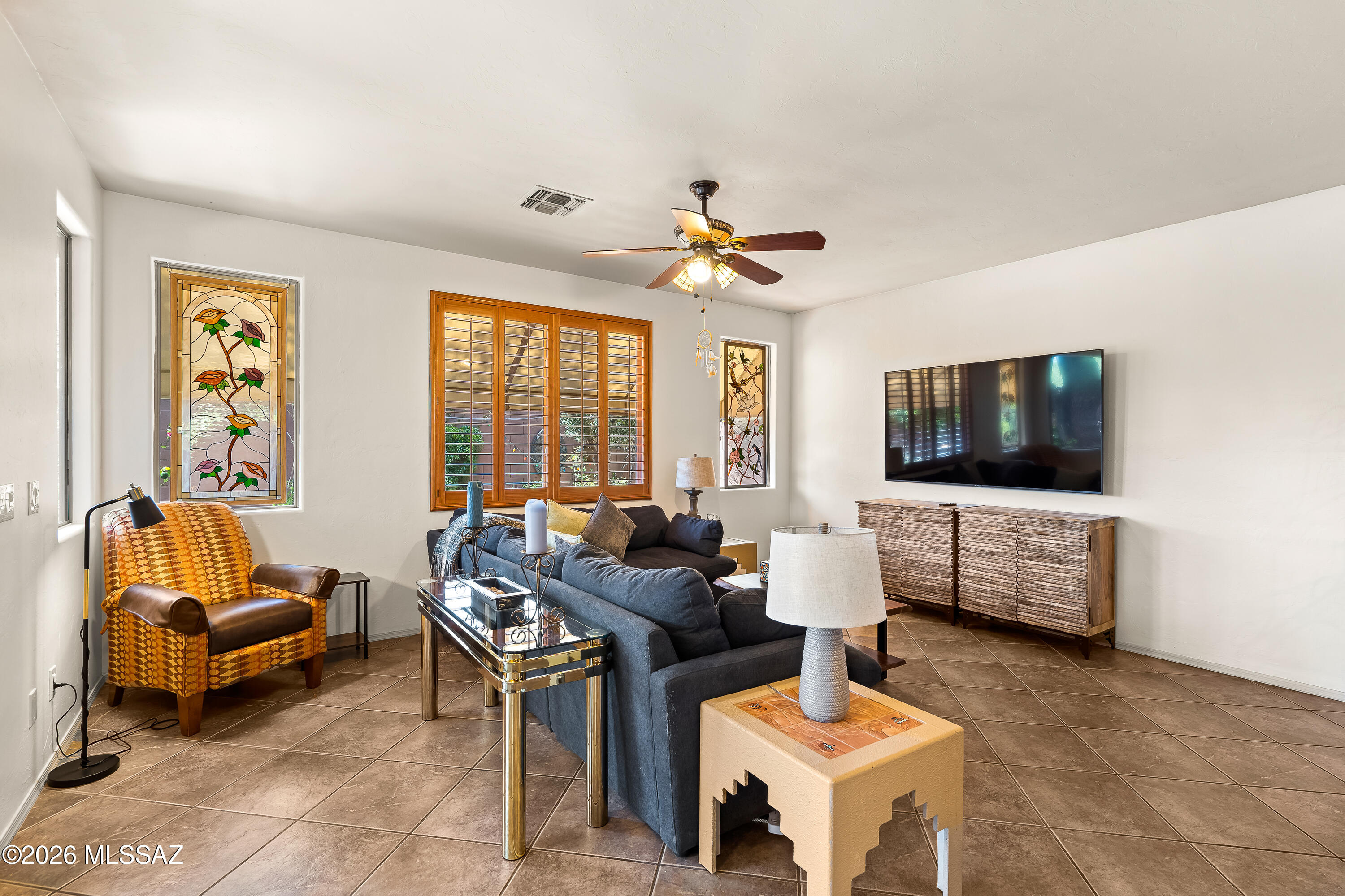 3396 North Camino Rio Colorado Tucson, AZ 85712 - Photo 13 of 32 a living room with furniture and a flat screen tv