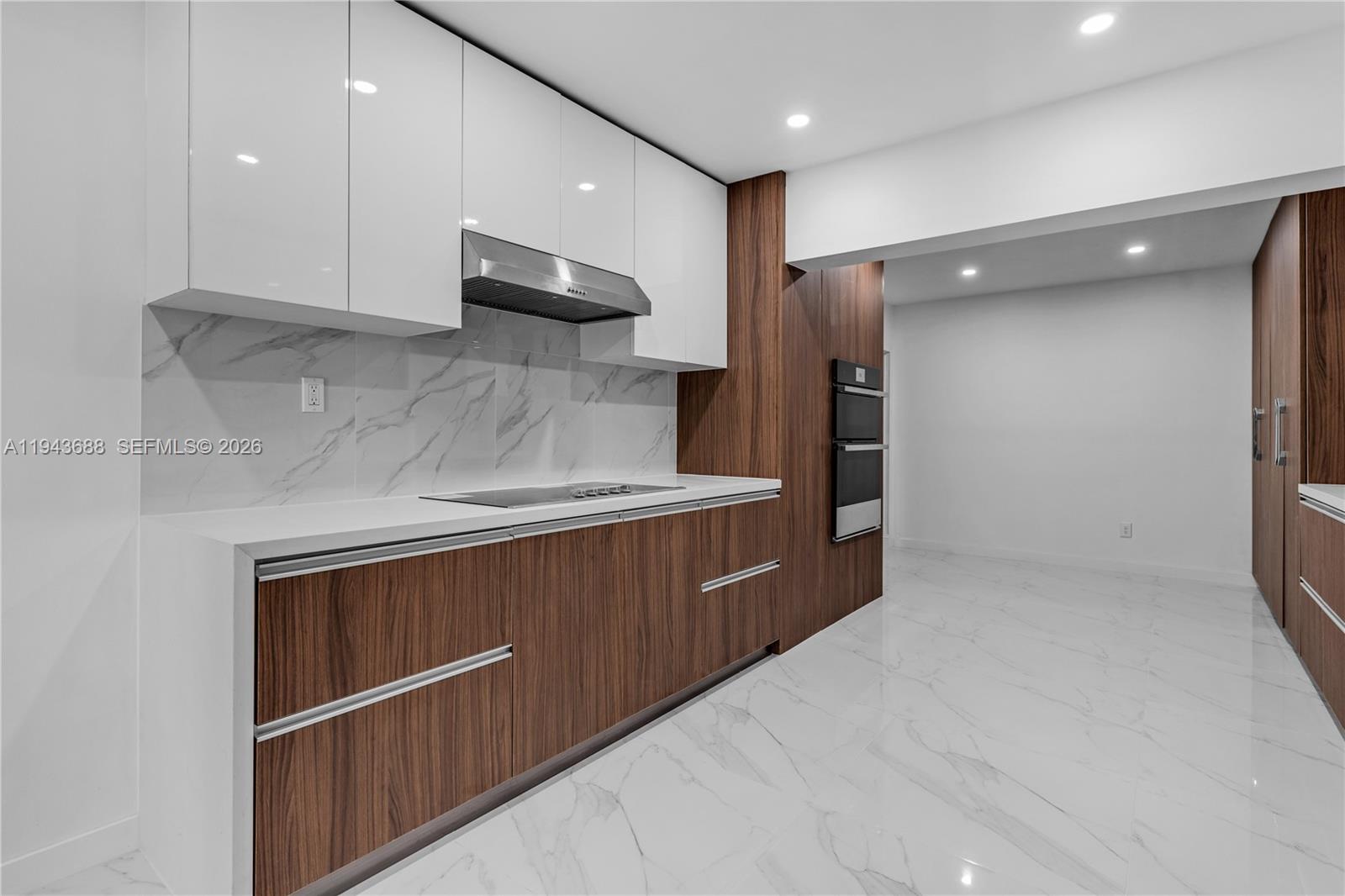 12525 Southwest 68th Court Pinecrest, FL 33156 - Photo 11 of 46 a kitchen with stainless steel appliances granite countertop a refrigerator and a sink