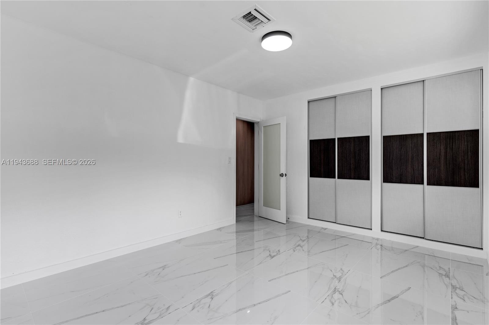 12525 Southwest 68th Court Pinecrest, FL 33156 - Photo 27 of 46 a view of empty room