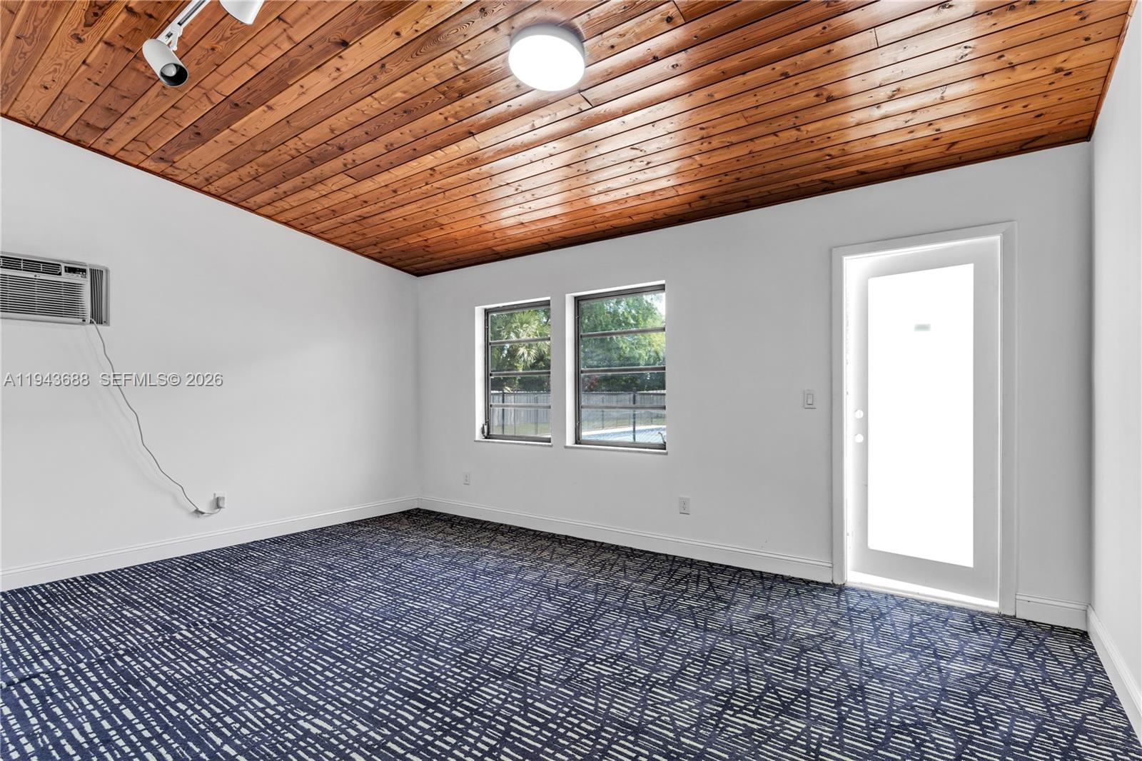 12525 Southwest 68th Court Pinecrest, FL 33156 - Photo 31 of 46 a big room with wooden floor