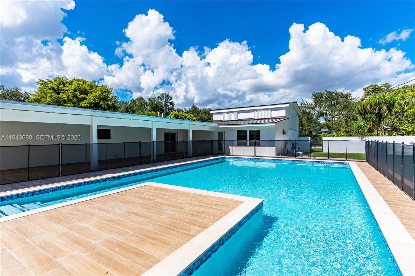 12525 Southwest 68th Court Pinecrest, FL 33156 - Photo 35 of 46 a front view of house with yard