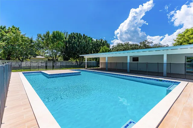 a view of a house with a swimming pool
