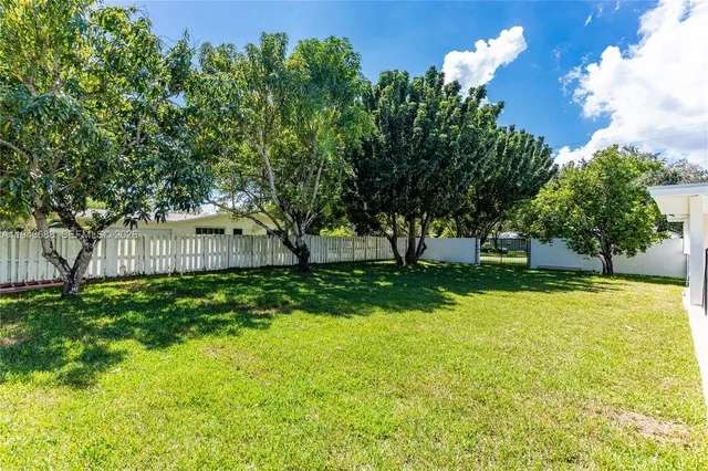 a backyard of a house with lots of green space