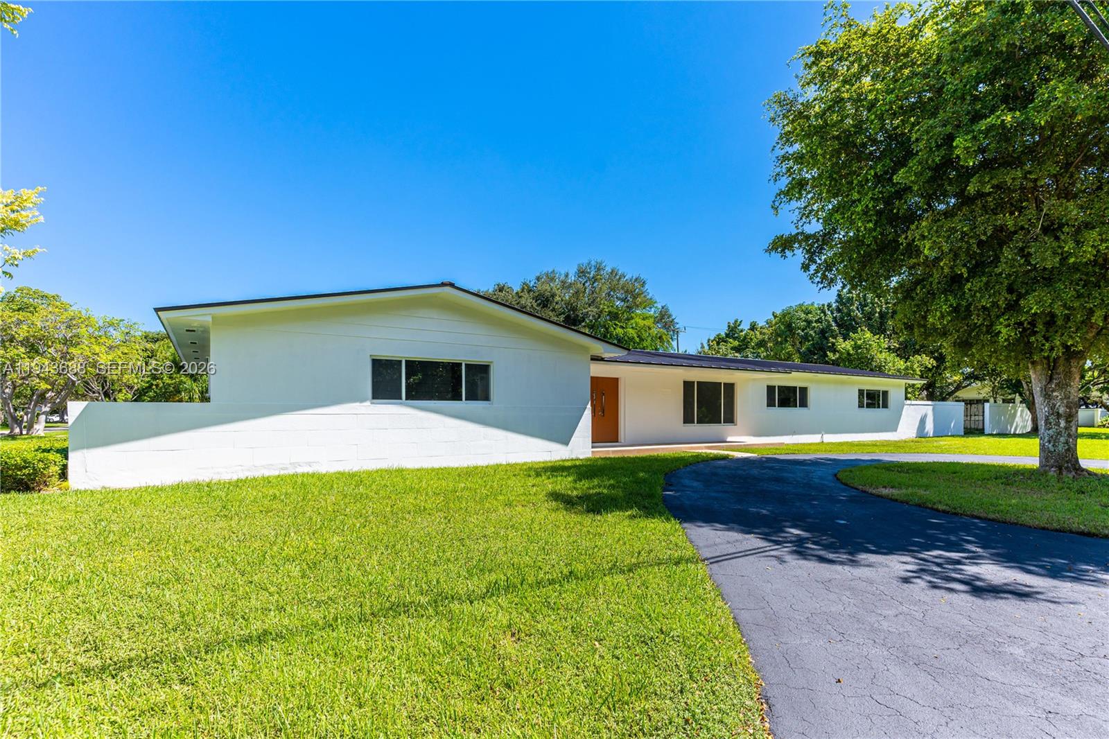 12525 Southwest 68th Court Pinecrest, FL 33156 - Photo 43 of 46 a house with outdoor space