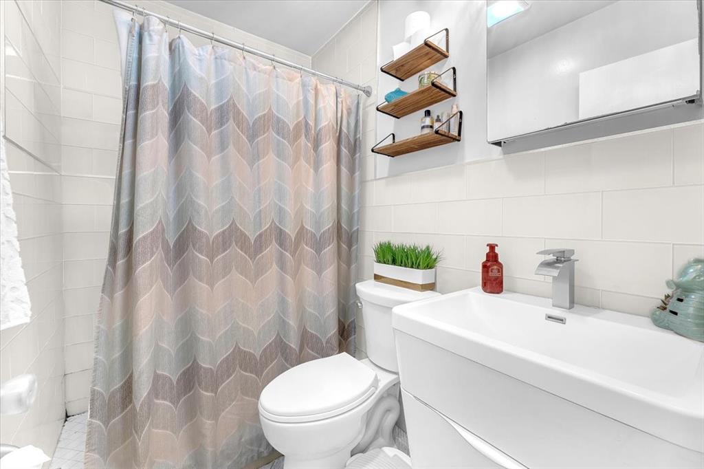 6621 Southwest 19th Street Pompano Beach, FL 33068 - Photo 11 of 16 a bathroom with a sink toilet and shower