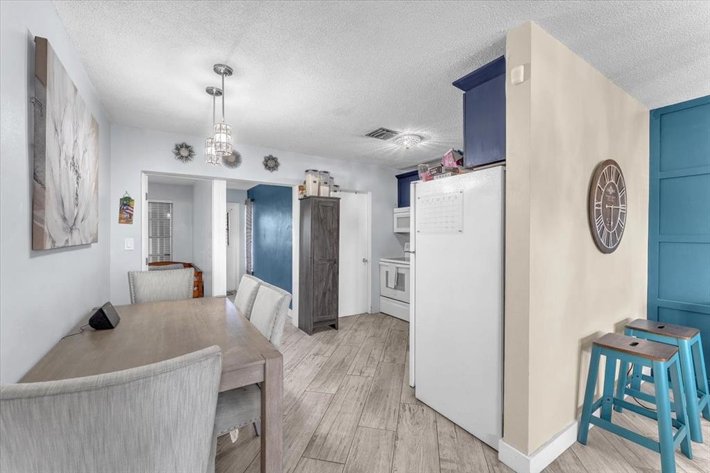 6621 Southwest 19th Street Pompano Beach, FL 33068 - Photo 5 of 16 a view of kitchen with furniture and wooden floor