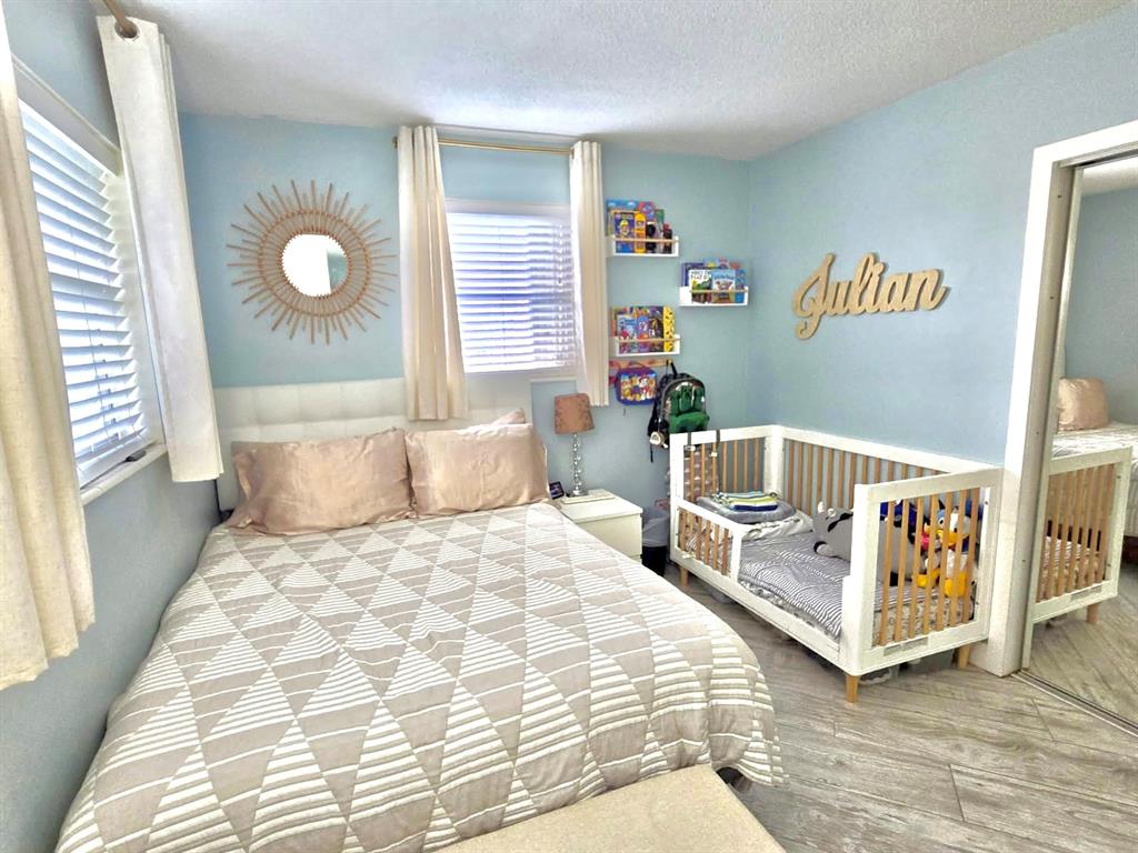 6621 Southwest 19th Street Pompano Beach, FL 33068 - Photo 9 of 16 a bedroom with a bed and a window