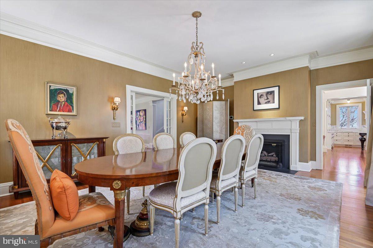922 Rolandvue Road Baltimore, MD 21204 - Photo 13 of 89 a dining room with furniture a chandelier and wooden floor