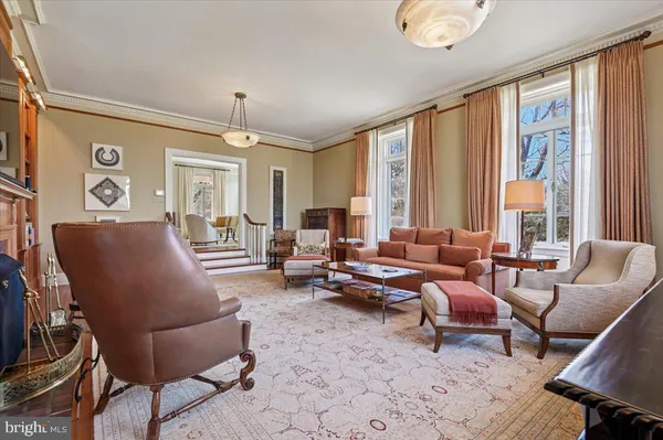 a kitchen with stainless steel appliances kitchen island granite countertop a stove a sink and a refrigerator